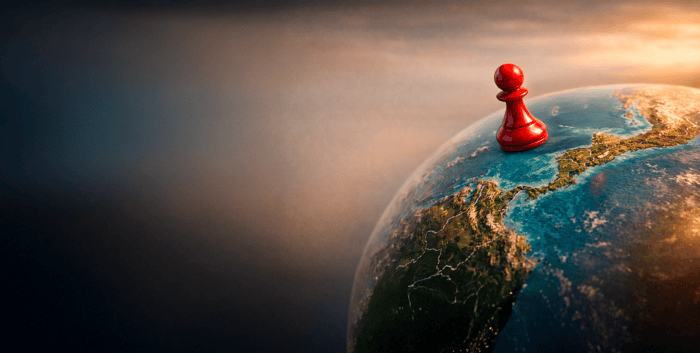 Red chess pawn on a globe focused on Central America from the Pacific Ocean, symbolizing strategy and regional positioning.